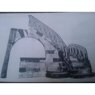 Burgundy Stone Staircase With Wrought Iron Handrail