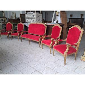 Quattro poltrone ed un divano dorati Napoleone III