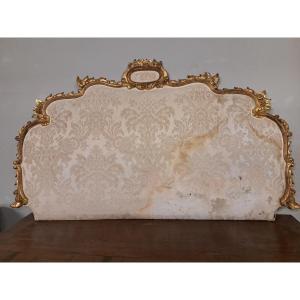 Testata di letto dorata ed imbottita