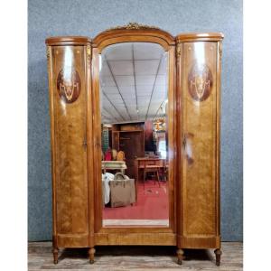 Louis XVI Style Wardrobe With A Projecting Top In Marquetry Of Precious Woods, Circa 1880.