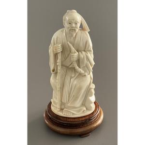 Carved Ivory Okimono Representing An Old Man 