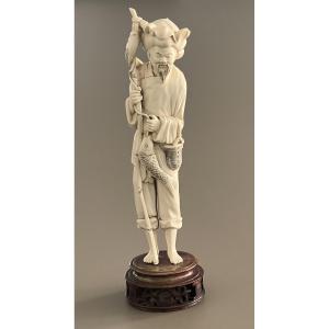 Signed Ivory Okimono Depicting A Standing Fisherman China 1920-30 