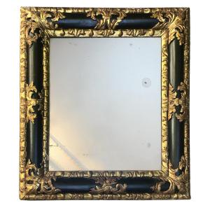 Louis XIV Period Mirror, Curved Molding In Blackened Pearwood And Carved Gilded Wood, Mid-17th Century 