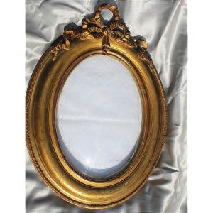 Oval Wooden And Gilded Stucco Frame With Curved Glass, Louis XVI Style, 19th Century