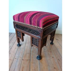 Oriental Stool With Thick Padding In A Striped Fabric Pattern In Shades Of Red