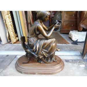19th Century Neoclassical Bronze Sculpture "seated Woman Holding A Bird"  