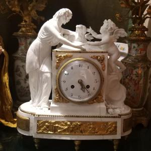 Orologio in bisquit applicazioni bronzo dorato