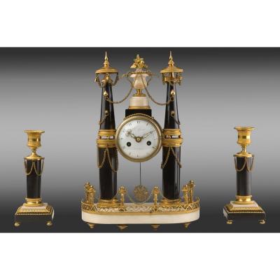 Pendulum And Its Bronze And Marble Candlesticks. Louis XVI
