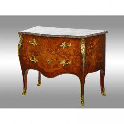 A Louis XV Period Commode In Marquetry From Different Woods