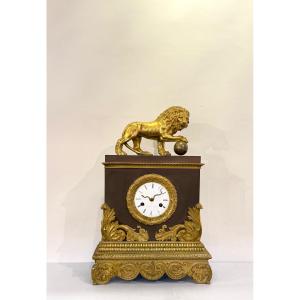 Restoration Period Clock In Gilt And Patinated Bronze.