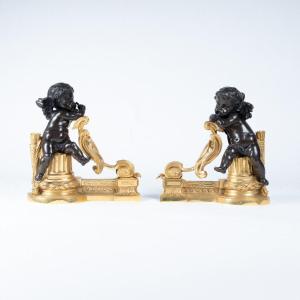 Extrémités de barre de foyer en bronze à décor de chérubins, XIXe