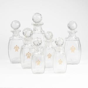 Maison Baccarat, Series Of 7 Crystal Bottles Monogrammed In Gold, 19th