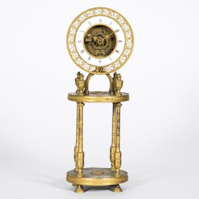 Pendule squelette à colonnes en bronze doré, XIXe