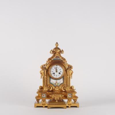 Pendule en bronze doré et plaque de porcelaine, XIXe