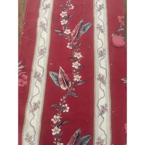 Fragment Of Old Printed Fabric From The 19th Century, Floral Decoration On A Red Background