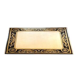 Large Hand Knotted Rug With A Wide Black And Gold Border And A Large Central Colored Field 