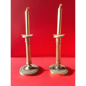 Pair Of Gilded Chiseled Bronze Candlesticks From The Early 19th Century.