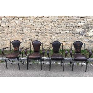 Set Of Four Armchairs In Iron, Brass And Leather By Jacques Adnet.