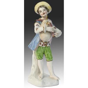 Porcelain Statuette A Young Boy Playing The Bagpipes