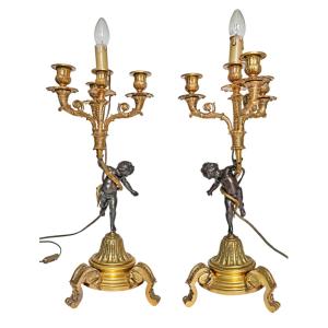 Pair Of Bronze Candelabra Decorated With Putti Supporting Cornucopias