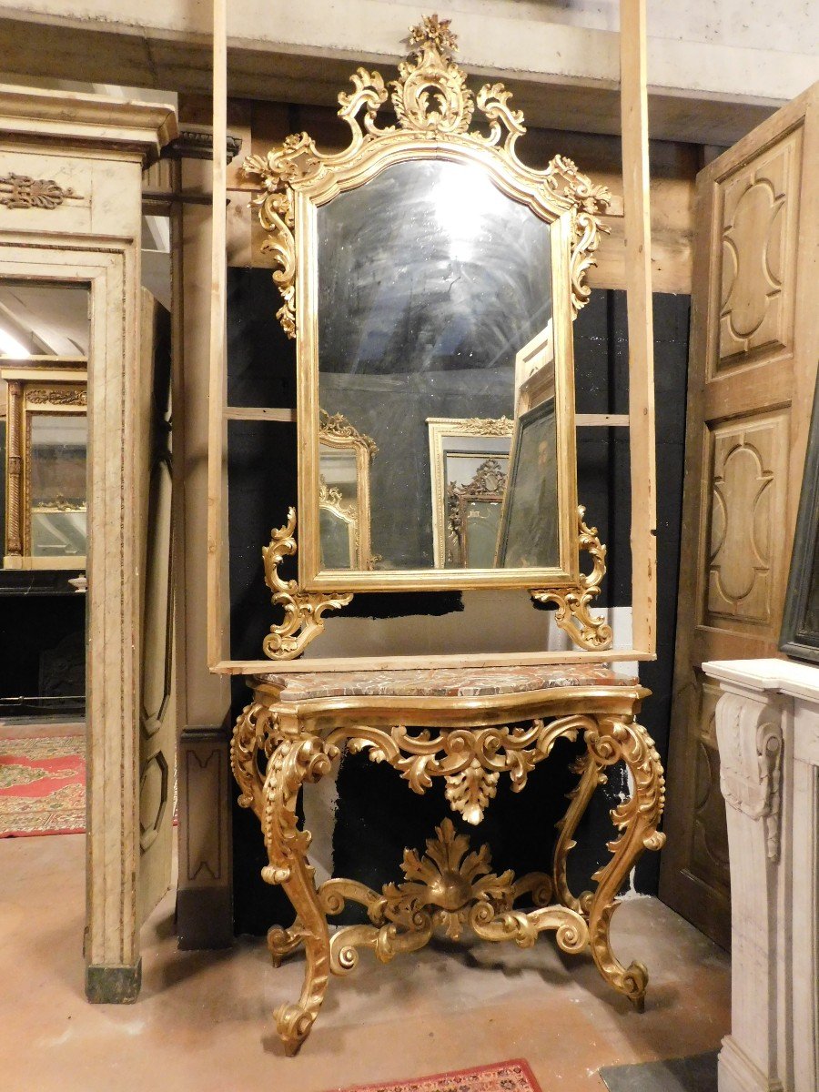 Consolle con specchiera in legno dorato e scolpito a decori floreali, piano in marmo rosso, napoli