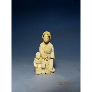 Ivory Okimono. Woman, Child And Puppy. Japan Meiji Period (1868-1912)