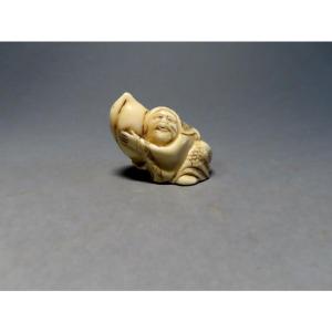 Ivory Netsuke. Ebisu And The Longevity Peach. Signed Masayuki. Japan. Meiji Period (868-1912).