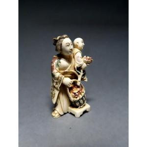 Ivory Netsuke. The Little Flower Seller. Japan, Taisho Period (1912-1928)