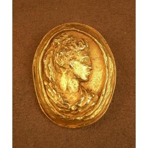 Vintage Gold-tone Metal Brooch Signed Christian Lacroix, Depicting A Woman In Antique Cameo Style