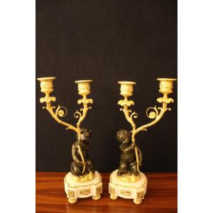 Pair Of Small Candlesticks With Putti In Gilt And Patinated Bronze, Louis XVI Style, XIXth Century