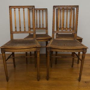 Set Of Four Louis XVI Style Chairs In Carved Wood