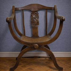 Art Nouveau Style Curule Chair / In Carved Walnut – Cane Seat 