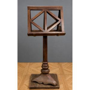 Large Solid Oak Music Stand Resting On A Central Turned Base With A Trilobed Base