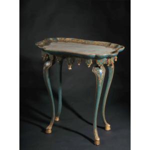 On Curved Legs With A Tassel Bar Around The Edge. The Top Is Worked As A Shelf With A Central W