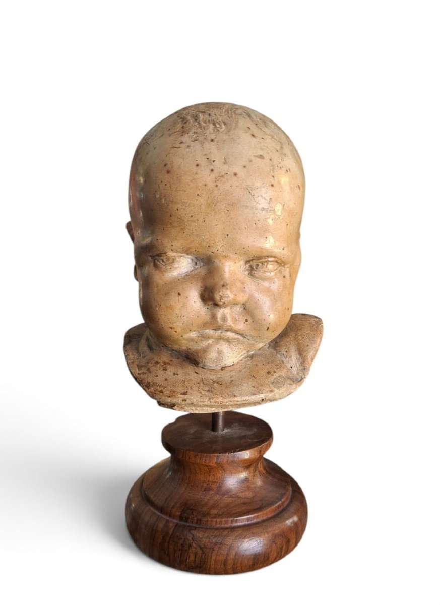 Testa di bambino in terracotta