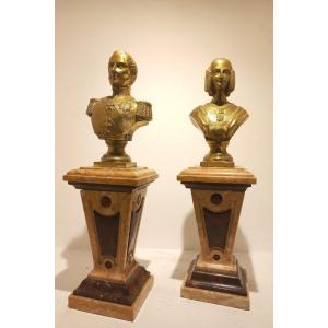Coppia di piccoli busti in bronzo dorato