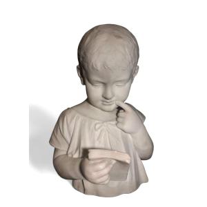 Busto di bambino in lettura, marmo di Carrara