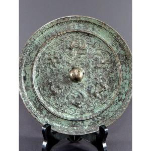 China, Mid-20th Century, Metal Mirror Featuring A Decoration Of Phoenixes And Kilins.