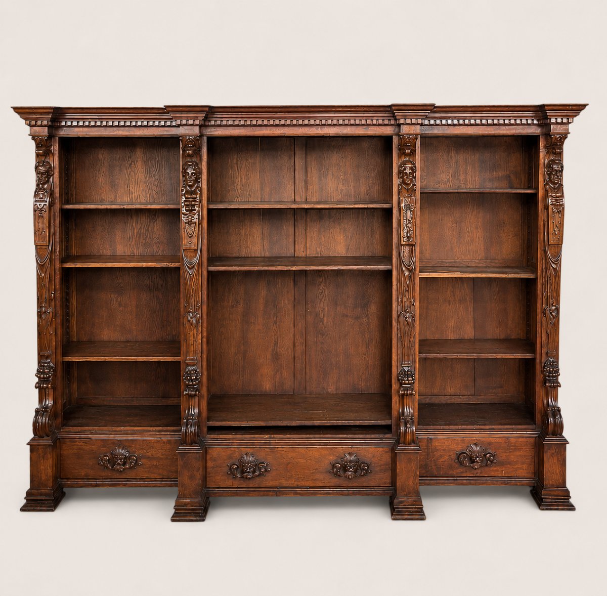 Importante libreria monumentale in noce scolpito, gusto Rinascimento, XIX secolo