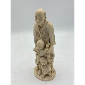 Okimono In Ivory Representing A Man And His Children