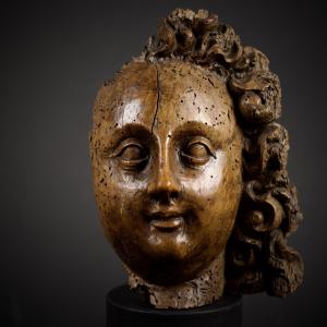Fragment Of A Baroque Angel's Head In Carved Wood, 17th Century
