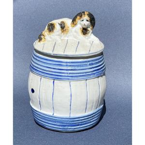 Porcelain Biscuit Tin In The Shape Of A Barrel With A Lying King Charles Spaniel