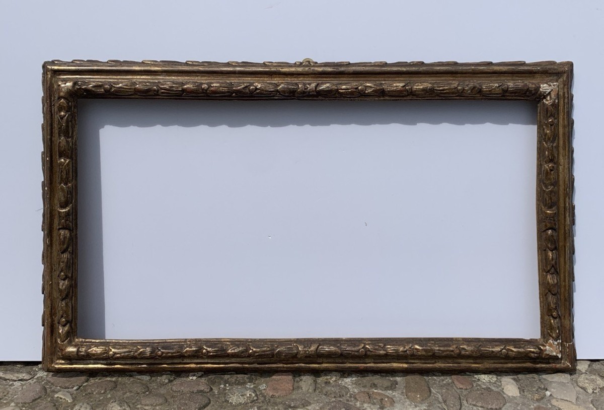 Cornice barocca in legno intagliato e dorato. Lombardia, XVII secolo.-photo-1