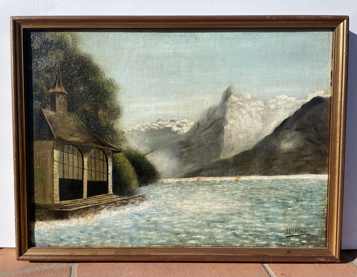 Pittore britannico (XIX - XX secolo) - Paesaggio lacustre alpino con rimessa per barche.-photo-1