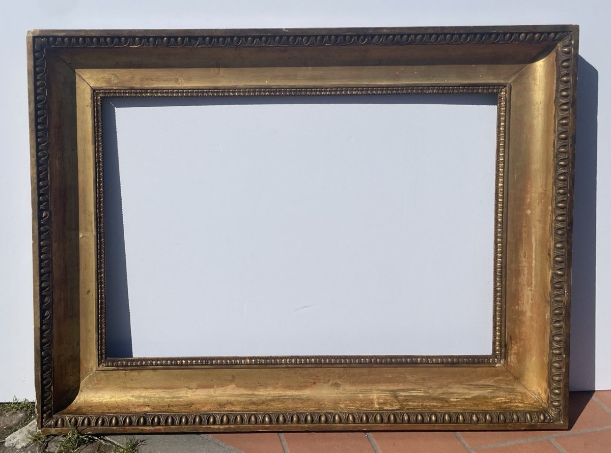 Cornice in legno intagliato e dorato. Napoli, XIX secolo.-photo-1