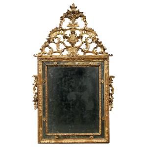Grande specchiera in legno intagliato e dorato. Venezia, XVIII-XIX secolo.