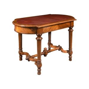 Tavolino lastronato in noce con piano in cuoio - Italia, XIX secolo.