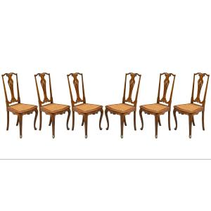 Sei sedie in legno di noce intagliato e traforato. Venezia, fine XIX secolo.