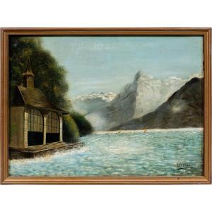 Pittore britannico (XIX - XX secolo) - Paesaggio lacustre alpino con rimessa per barche.