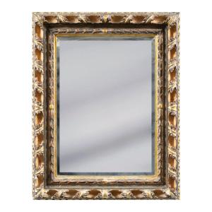 Specchiera Liberty in legno intagliato e dorato. Italia, XX secolo.